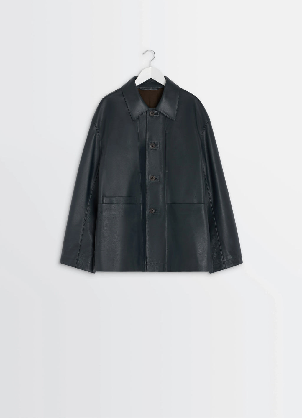 Lemaire leather workwear jacket in thick cow leather, grained, product shot, hanging view even hemline, minimalist design
