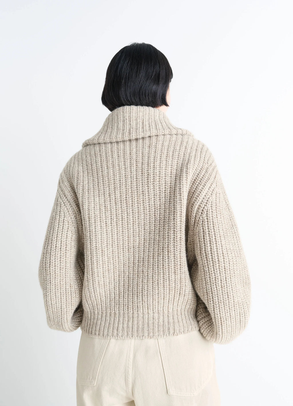 Zip-up cardigan with stand-up colla in alpaca and yak wool knit, model shot, back view oversized silhouette