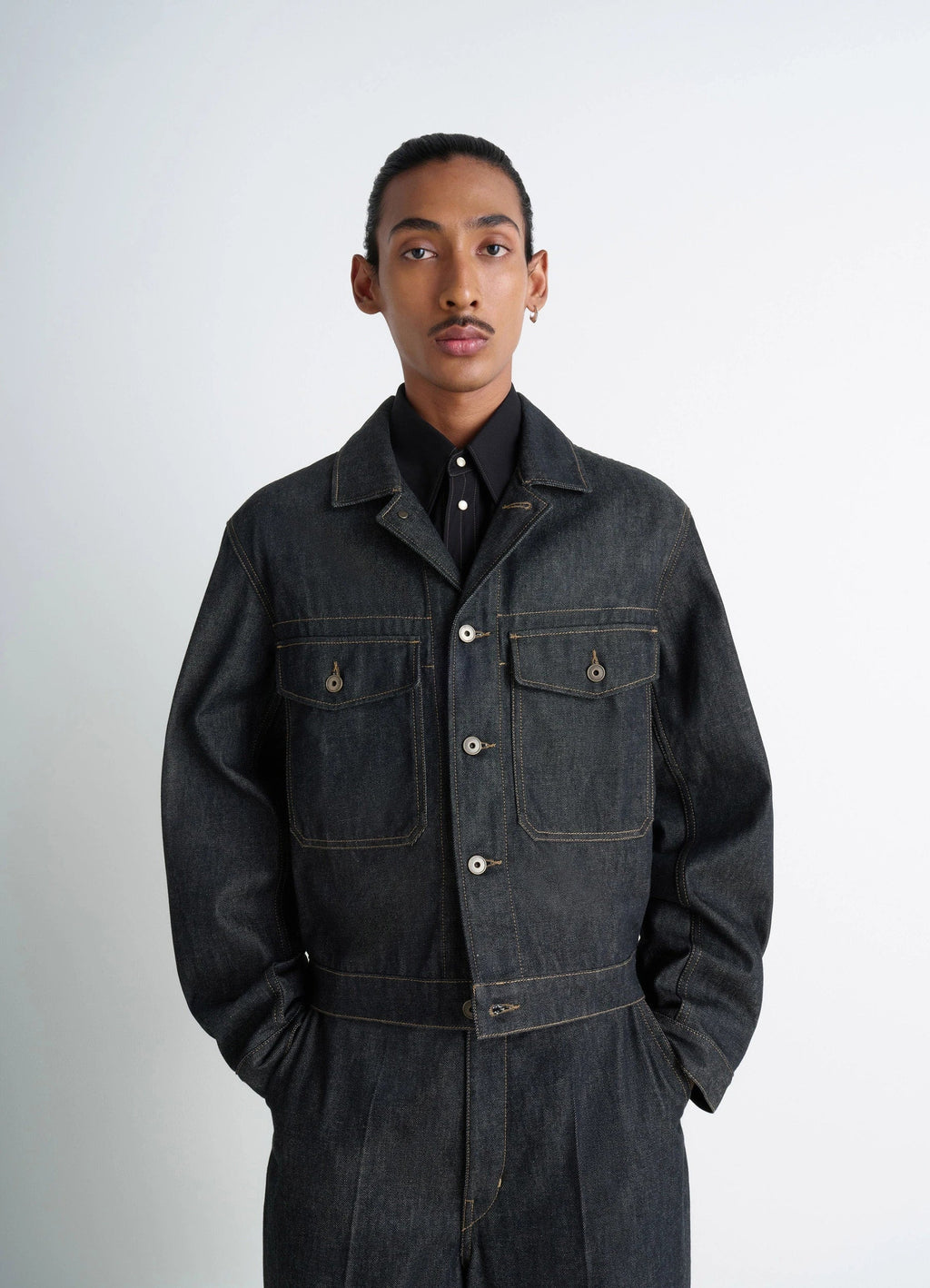 Lemaire trucker jacket in slate denim, model shot, front view boxy fit with pockets
