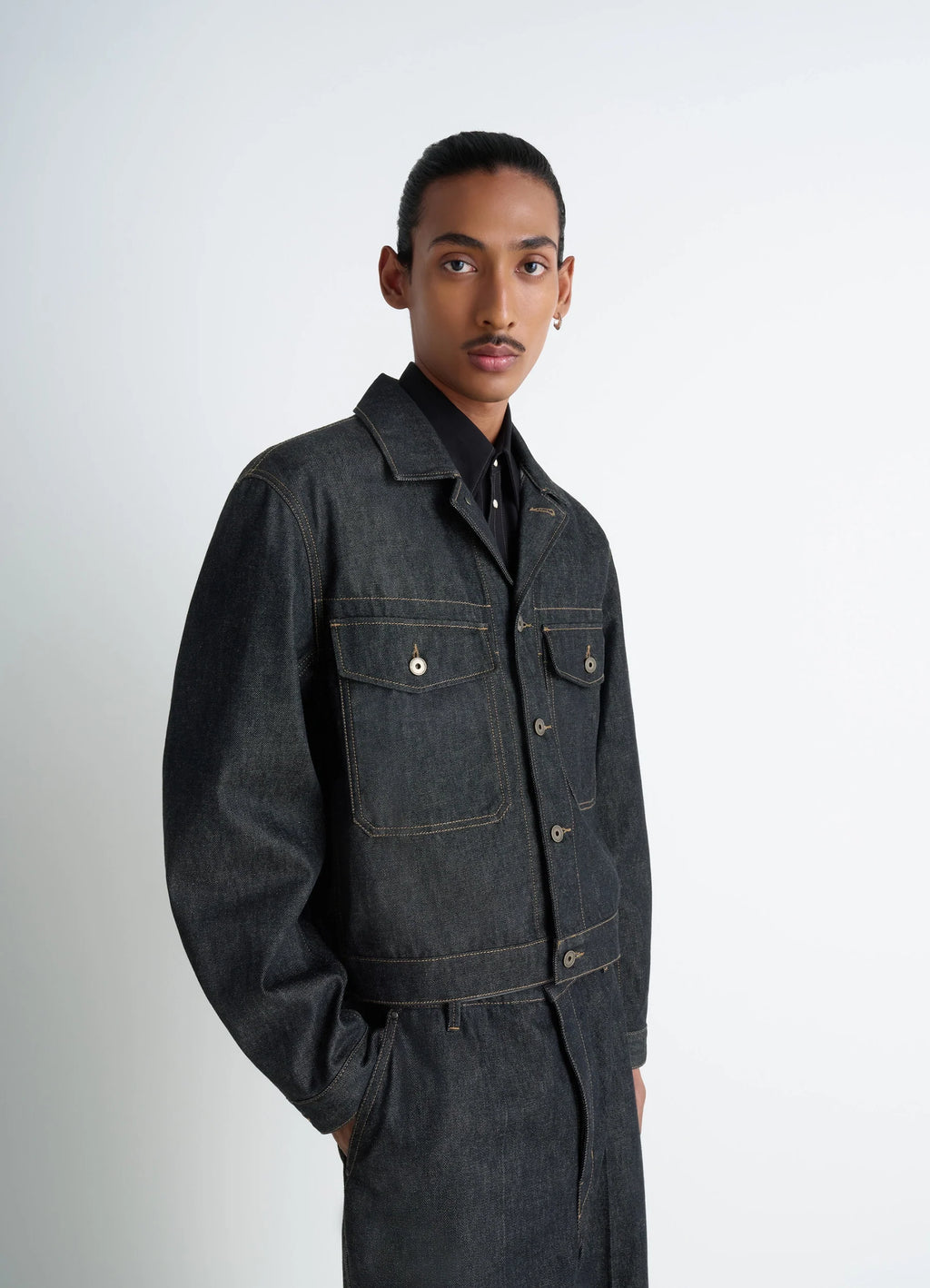 Lemaire trucker jacket in slate denim, model shot, shoulder view relaxed shoulder cut