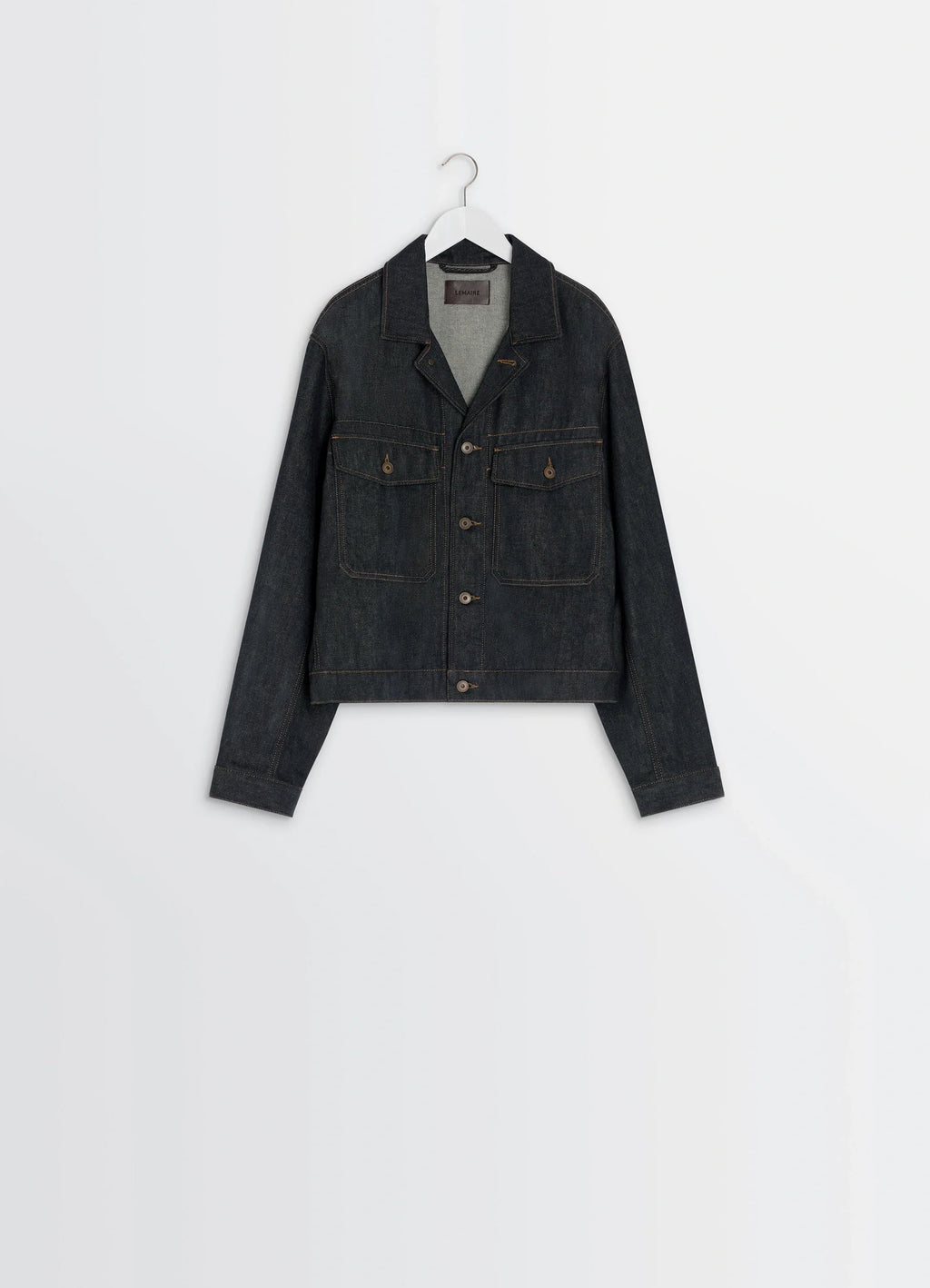 Lemaire trucker jacket in slate denim, product shot, hanger view top button fastened