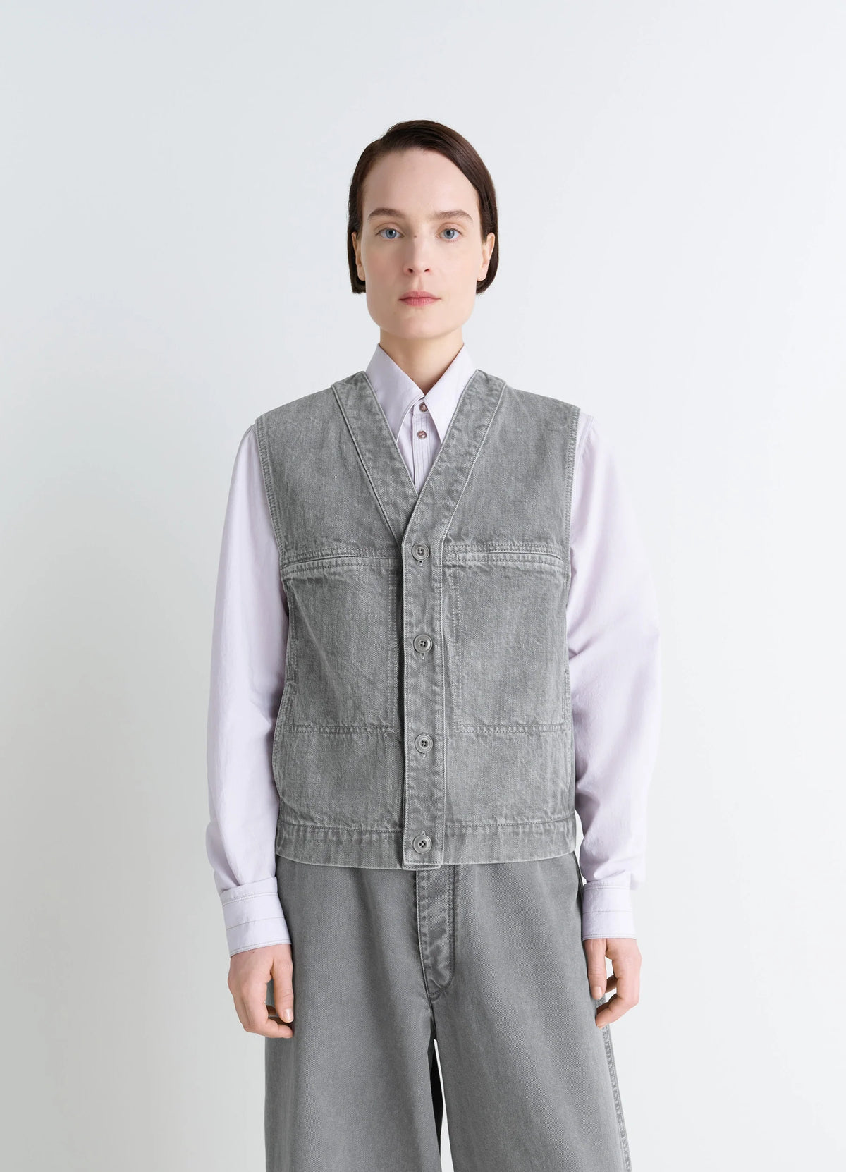 Lemaire Pocket Gilet in Garment Dyed Snow Denim, model shot, front view utilitarian aesthetic