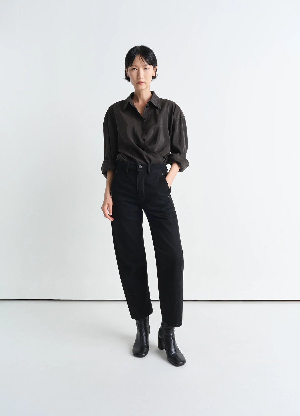 Lemaire Twisted Pants in Deep Black Heavy Denim, model shot, front view straight cut workwear