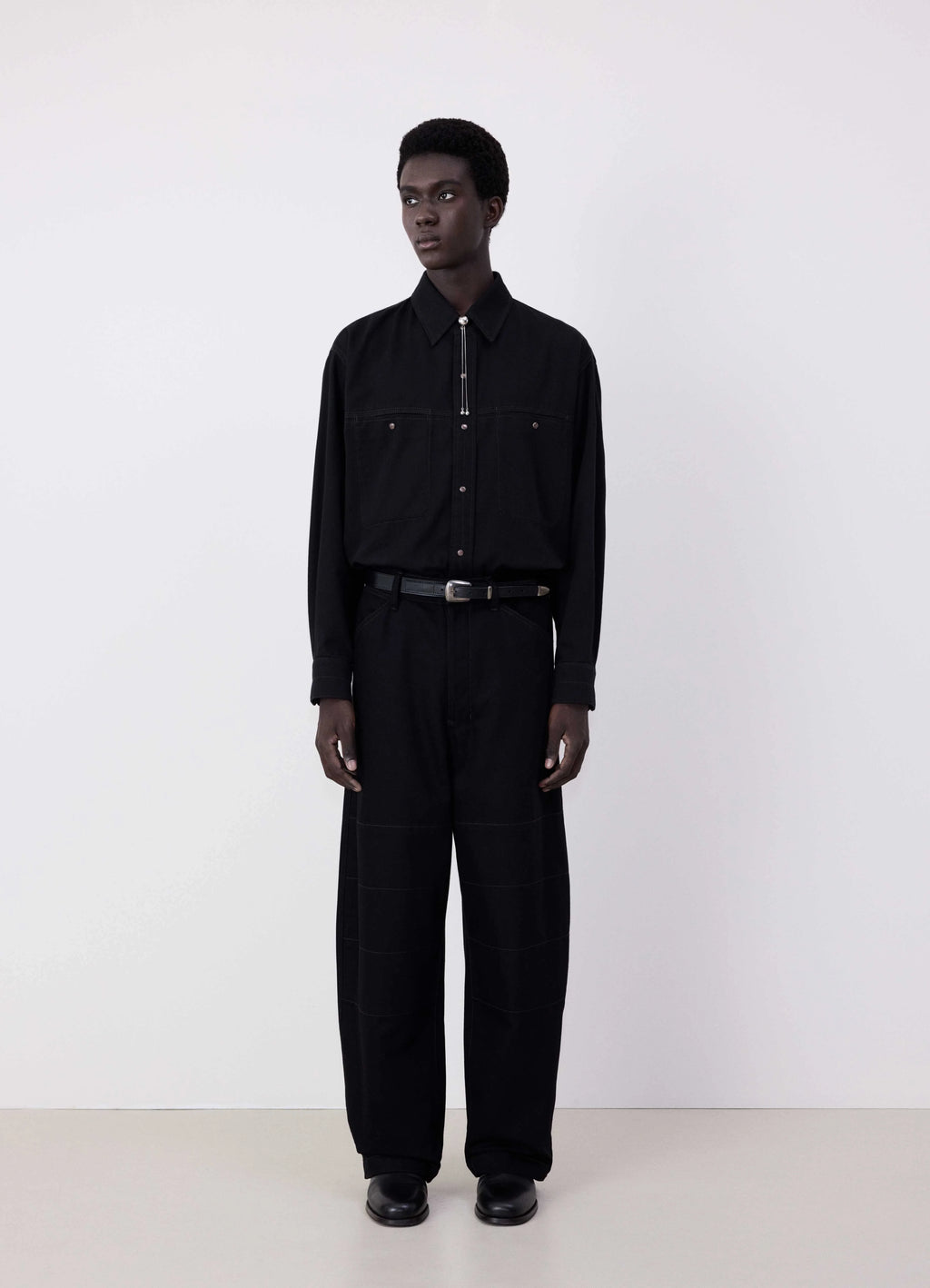 Lemaire judo pants in heavy yarn dyed black denim, model shot, front view boxy style, wide leg