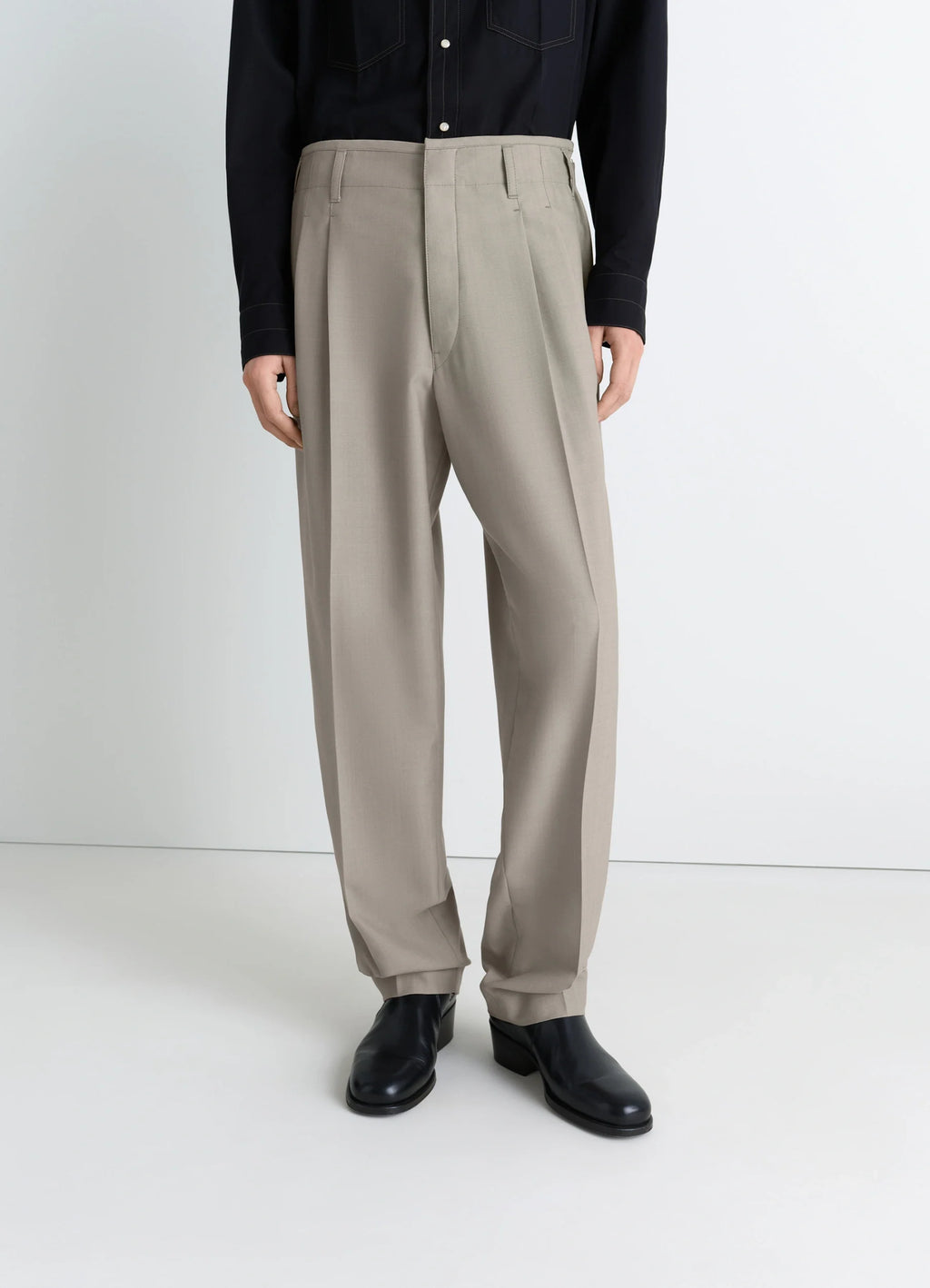 Lemaire pleated pants in tropical wool-blend suiting, model shot, side view relaxed fit