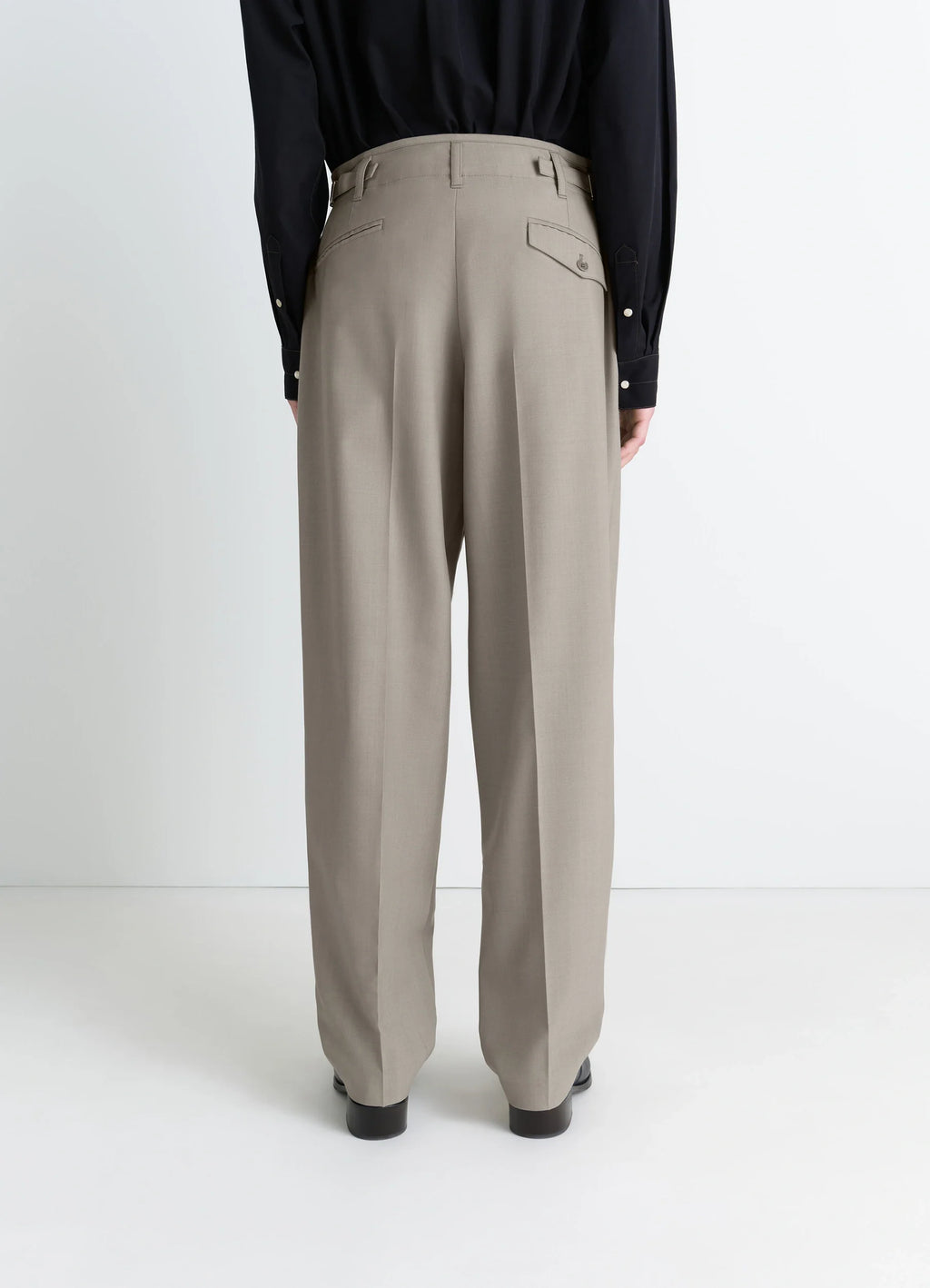 Lemaire pleated pants in tropical wool-blend suiting, model shot, back view high-waist