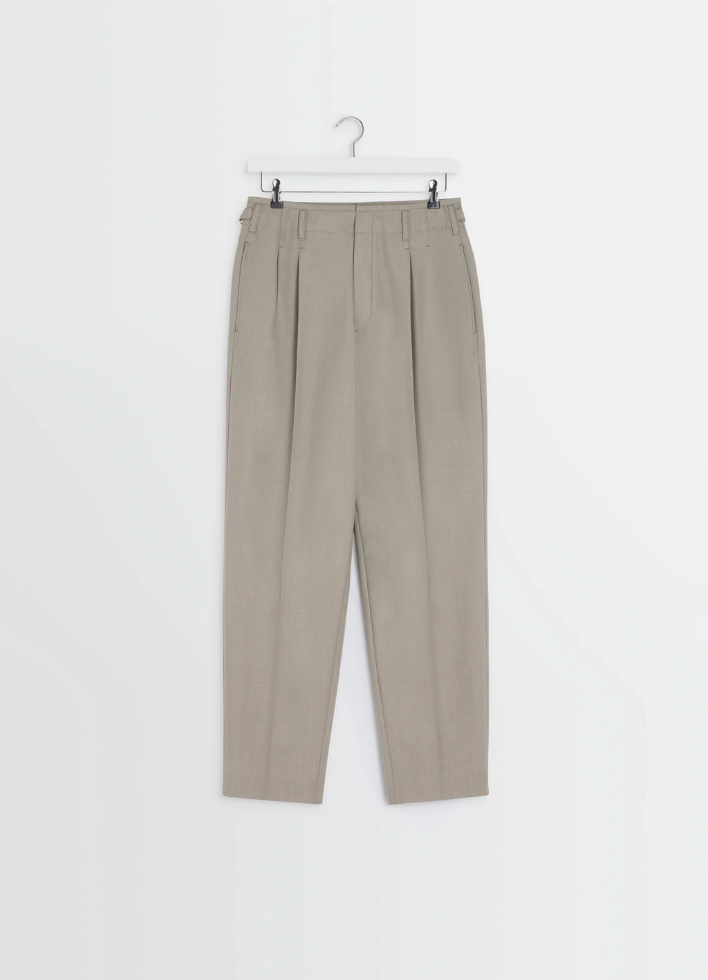 Lemaire pleated pants in tropical wool-blend suiting, product shot, hanging front view belt loops, tapered leg