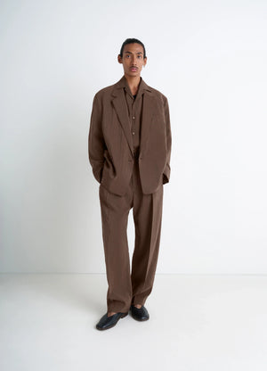 Lemaire belted relaxed pants in brown dry silk blend, model shot, front view relaxed fit with belt