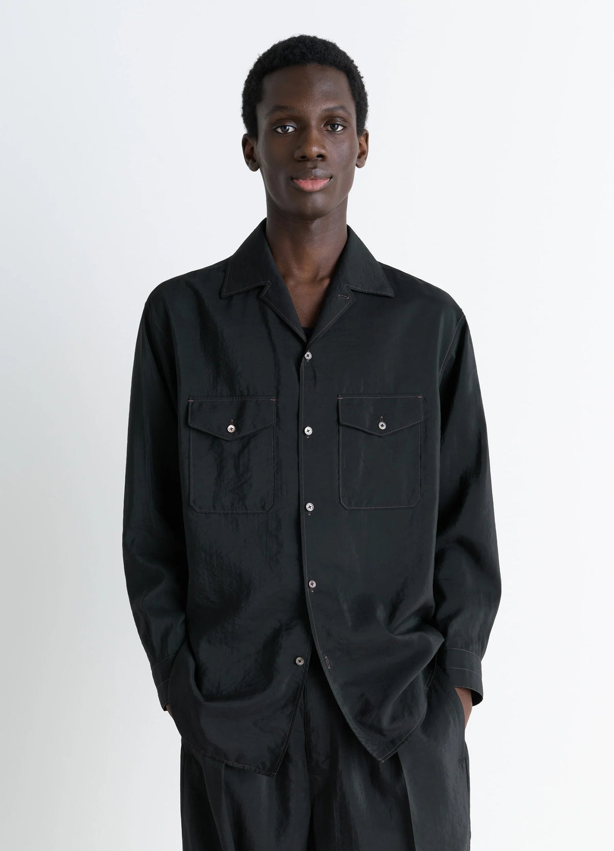 Lemaire Convertible Collar Shirt in Black Dry Silk Blend, model shot, Front view Convertible collar, relaxed fit