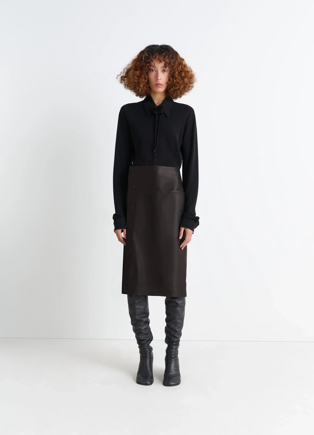 Lemaire Leather Wrapover Skirt in Supple Cow Leather, model shot, Front view Wrapover with snap closure