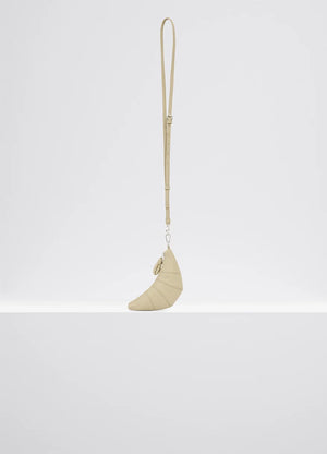 Cross-body croissant coin purse in soft grained leather, product shot, side view zipped compartment