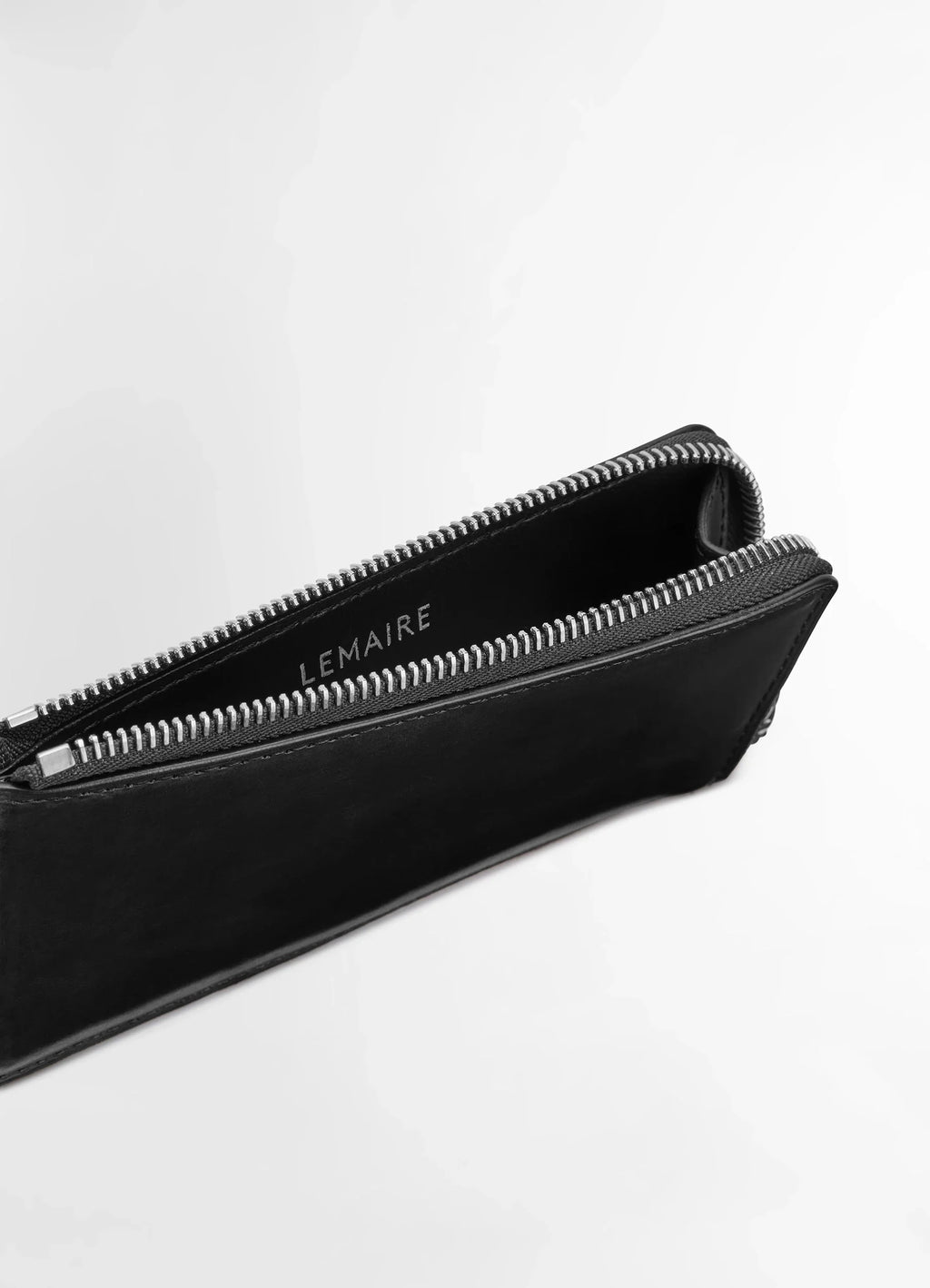 Patina zip coin card holder in soft black leather, product shot, top angled view open zipper detail