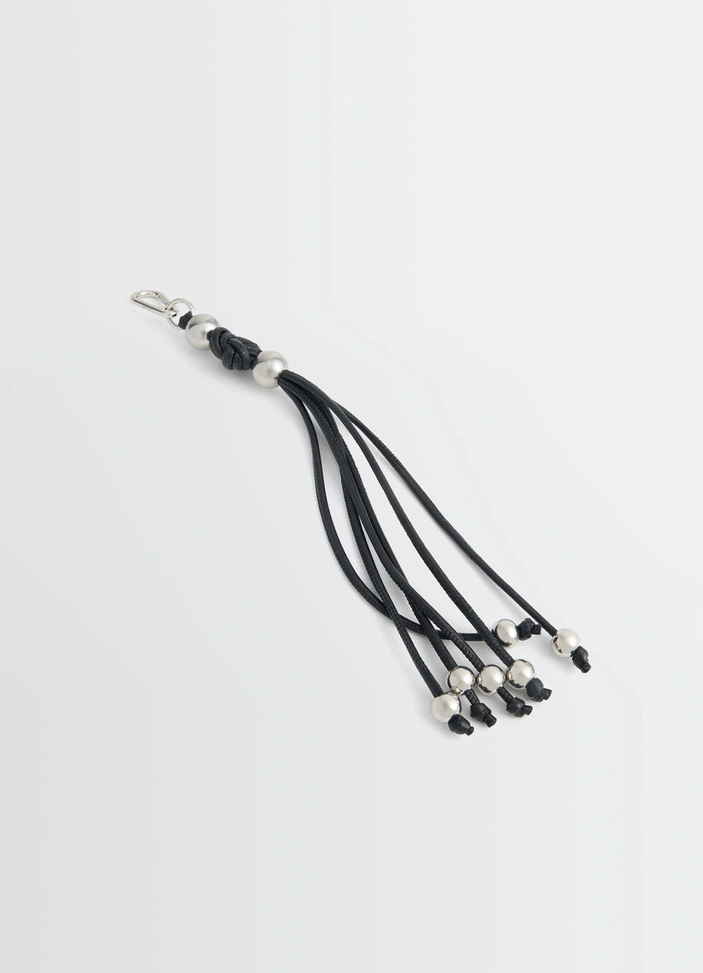 Infinite love knot key ring in nappa lamb leather, product shot, top angled view beaded tassel strands