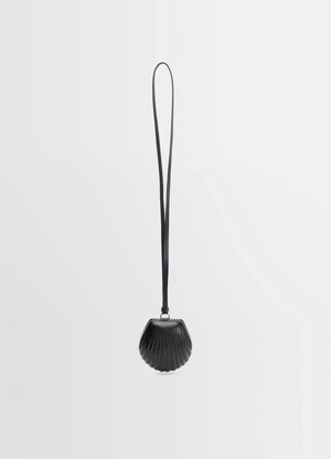 Carlos shell coin purse necklace in black vegetable-tanned leather, product shot, front view seashell shape