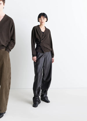Lemaire relaxed twisted cardigan in knitted merino wool, model shot, front view asymmetrical button placket