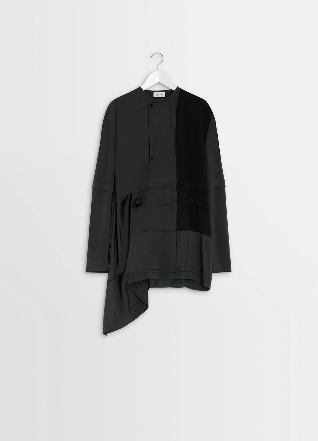 Blouse with pleats in black patchwork crepe de chine, product shot, hanging shot draped asymmetric hem