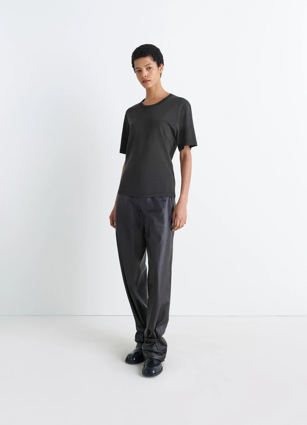 Lemaire rib t-shirt in black cotton jersey, model shot, three-quarter view relaxed fit