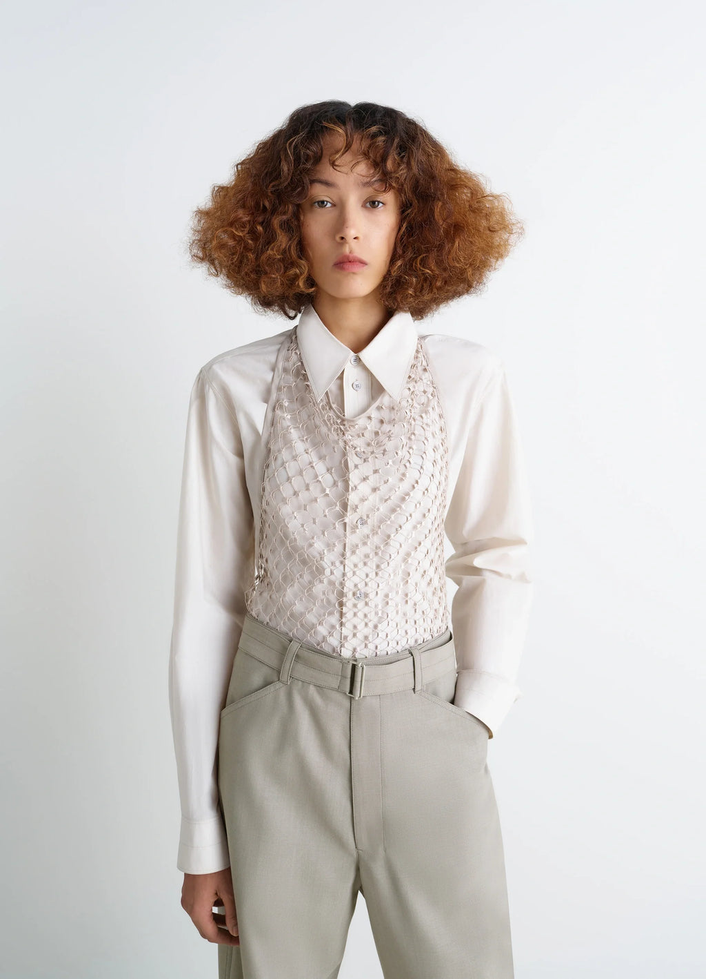 Lemaire fishnet halter top in cream fishnet, model shot, front view worn over shirt